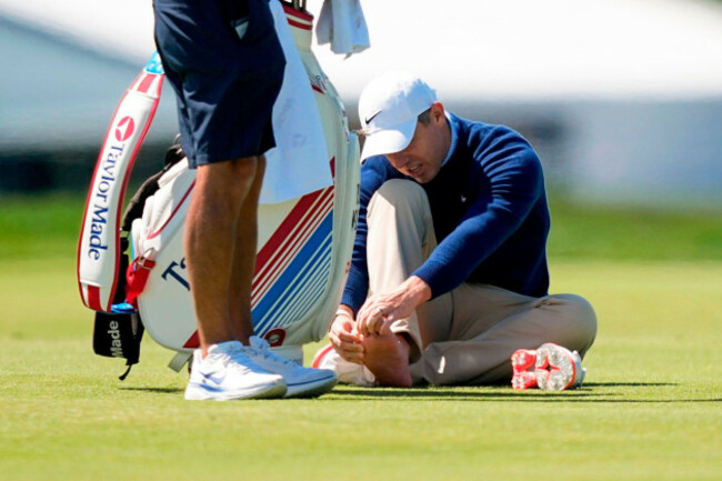 rory-mcilroy-of-northern-ireland-attends-t-this-foot-on-the-third-fairway-during-a-pga-championship-golf-tournament-practice-round-at-aronimink-golf-club-tuesday-may-12-2026-in-newtown-square-p
