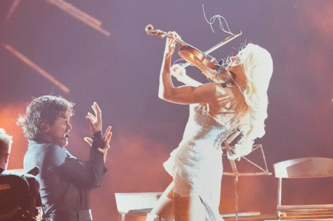 linda-lampenius-and-pete-parkkonen-from-finland-perform-the-song-liekinheitin-during-the-first-semifinal-of-the-70th-eurovision-song-contest-in-vienna-austria-tuesday-may-12-2026-ap-photomart