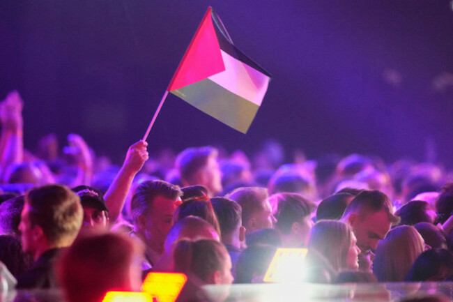 a-palestinian-flag-is-held-up-as-the-crowd-waits-for-the-votes-to-be-counted-during-the-first-semifinal-of-the-70th-eurovision-song-contest-in-vienna-austria-tuesday-may-12-2026-ap-photomartin
