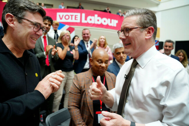 britains-labour-party-leader-keir-starmer-right-speaks-to-andy-burnham-mayor-of-greater-manchester-at-the-launch-of-the-labour-partys-2024-general-election-manifesto-in-manchester-england-thur
