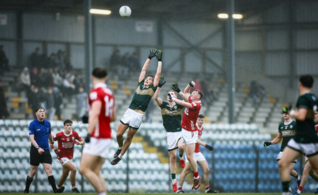 danny-murphy-and-cian-stack-challenge-for-the-ball-with-conor-garvey