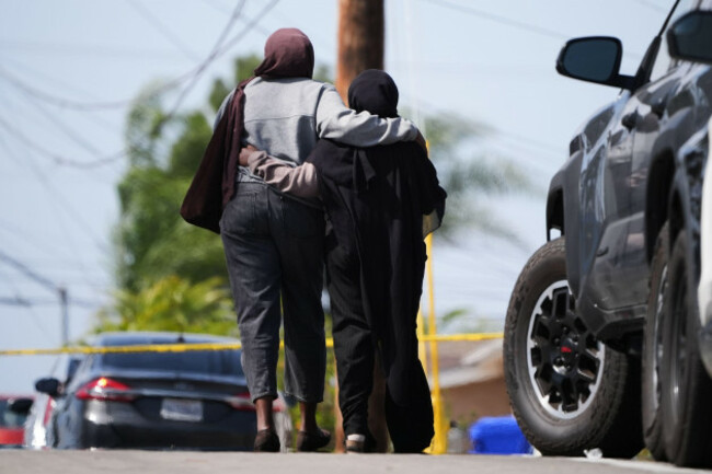 two-women-embrace-near-the-scene-of-a-shooting-outside-the-islamic-center-of-san-diego-monday-may-18-2026-in-san-diego-ap-photogregory-bull
