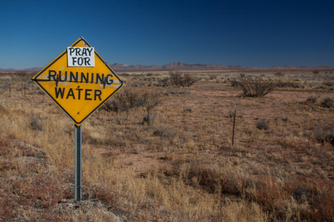 pray-for-running-water-a-humorous-sign-pointing-to-drought-in-southwestern-new-mexico-in-the-age-of-global-climate-change