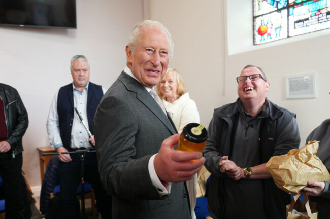 king-charles-iii-is-gifted-a-jar-of-honey-at-the-pantry-foodbank-in-donard-methodist-church-newcastle-on-day-two-of-the-royal-visit-to-northern-ireland-the-initiative-provides-free-food-parcels-and