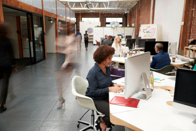 business-team-working-at-desks-in-modern-open-plan-office