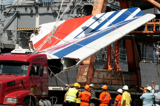 file-in-this-sunday-june-14-2009-file-photo-workers-unload-debris-belonging-to-crashed-air-france-flight-af447-from-the-brazilian-navys-constitution-frigate-in-the-port-of-recife-northeast-of