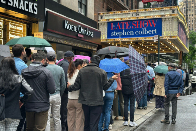 fans-line-up-in-the-rain-outside-the-ed-sullivan-theater-in-new-york-on-thursday-may-21-2026-ahead-of-the-final-episode-of-the-late-show-with-stephen-colbert-ap-phototed-shaffrey