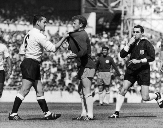 england-soccer-match-1966-ndave-mckay-left-of-tottenham-hotspur-confronts-billy-bremner-of-leeds-united-during-a-game-22-august-1966-referee-norman-burtenshaw-blows-his-whistle-to-intervene