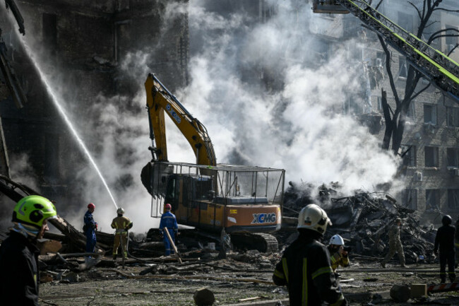 kyiv-ukraine-24th-may-2026-ukrainian-firefighters-dig-through-rubble-and-extinguish-flames-in-a-residential-building-during-rescue-operations-in-kyiv-on-may-24-2026-rescue-efforts-take-place-in