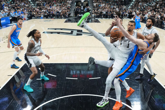 san-antonio-spurs-forward-victor-wembanyama-1-competes-for-a-rebound-against-oklahoma-city-thunder-center-isaiah-hartenstein-right-during-the-first-half-of-game-4-in-the-western-conference-finals