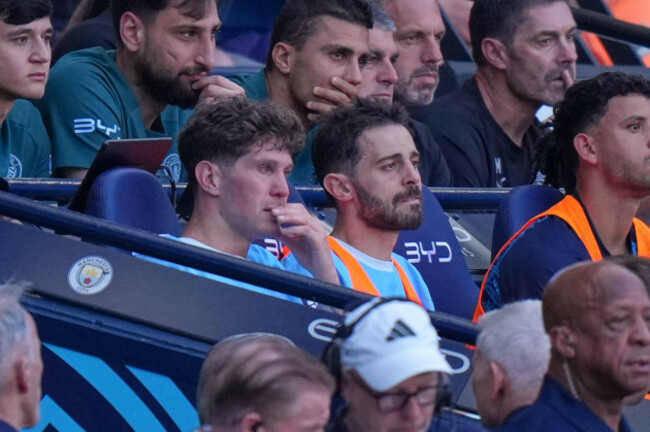 teary-eyed-manchester-citys-john-stones-and-bernardo-silva-sit-on-the-bench-after-palying-their-last-match-for-the-claub-during-a-premier-league-soccer-match-between-manchester-city-and-aston-villa