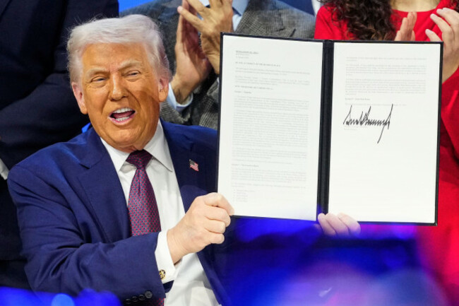 file-president-donald-trump-holds-the-charter-during-a-signing-ceremony-on-his-board-of-peace-initiative-at-the-annual-meeting-of-the-world-economic-forum-in-davos-switzerland-jan-22-2026-ap-p