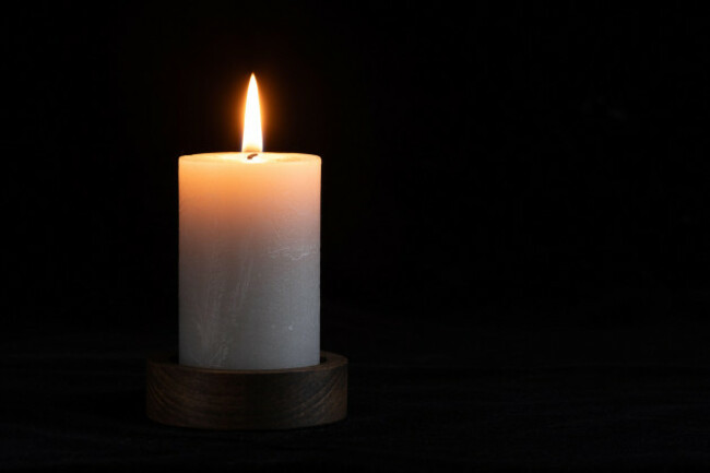 burning-candle-on-black-background-with-copy-space-for-your-text