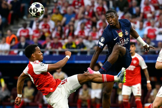 arsenals-jurrien-timber-left-and-psgs-willian-pacho-challenge-for-the-ball-during-the-champions-league-final-soccer-match-between-paris-saint-germain-and-arsenal-in-budapest-hungary-saturday-ma