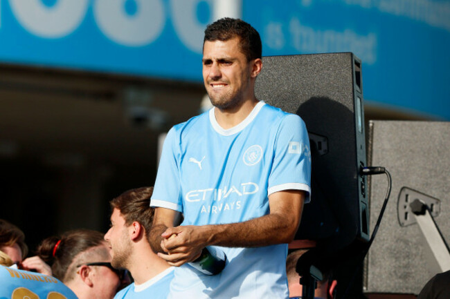 manchester-citys-rodri-on-the-team-bus-outside-the-etihad-stadium-during-a-parade-in-manchester-to-celebrate-the-achievements-of-the-manchester-city-mens-and-womens-teams-this-season-picture-date