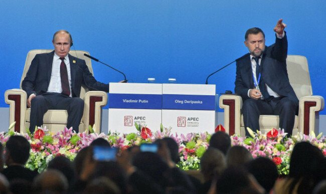 the-asia-pacific-economic-cooperation-apec-summit-head-of-the-basic-element-oleg-deripaska-right-and-russian-president-vladimir-putin-left-at-a-meeting-of-the-business-summit-of-the-asia-paci