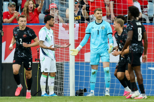 troy-parrott-and-goalkeeper-mark-travers-dejected-after-conceding