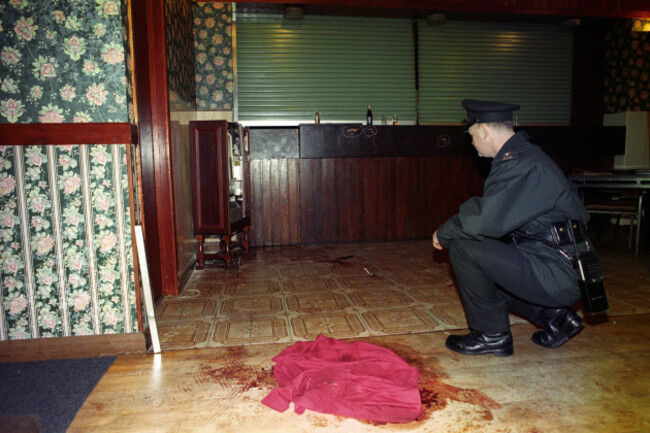 greysteel-an-ruc-officer-inspects-the-area-where-james-moore-81-was-shot-dead-along-with-six-other-people-in-the-rising-sun-pub-greysteel-londonderry