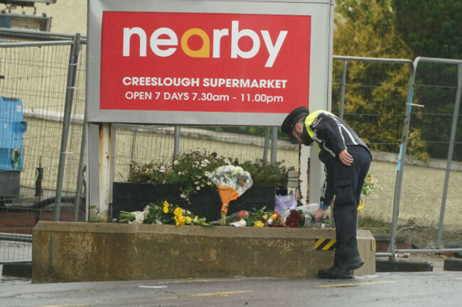 a-member-of-an-garda-lays-flowers-to-the-scene-of-an-explosion-at-applegreen-service-station-in-the-village-of-creeslough-in-co-donegal-where-ten-people-have-now-been-confirmed-dead-picture-date-su