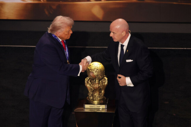 file-photo-dated-05-12-2025-of-us-president-donald-trump-is-presented-with-the-inaugural-fifa-peace-prize-award-by-fifa-president-gianni-infantino-has-been-criticised-by-his-old-boss-michel-platini-w