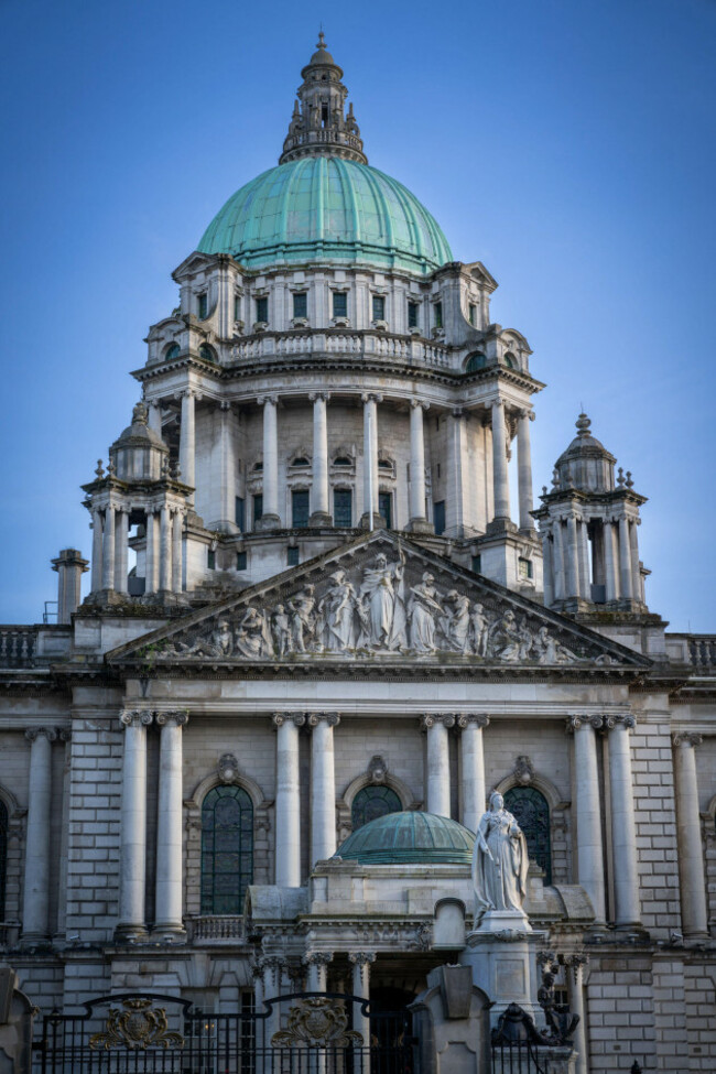 view-of-belfast-city-hall-in-northern-ireland-captured-in-the-late-afternoon-sunlight-with-a-clear-blue-sky-highlighting-its-historic-architecture-a