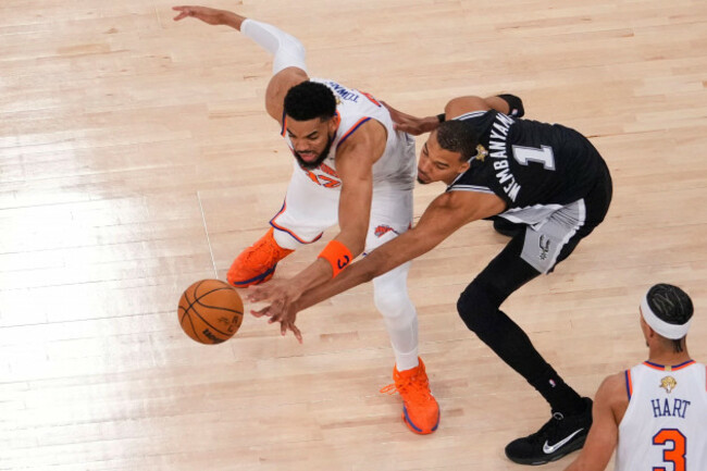 new-york-knicks-center-karl-anthony-towns-32-and-san-antonio-spurs-forward-victor-wembanyama-1-battles-for-the-ball-during-game-3-of-the-nba-finals-basketball-series-monday-june-8-2026-in-new