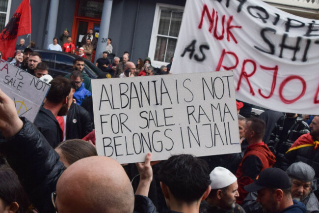london-uk-06th-june-2026-a-protester-holds-a-placard-stating-that-albanian-prime-minister-edi-rama-belongs-in-jail-as-members-of-the-albanian-diaspora-gather-outside-the-albanian-embassy-in-lond