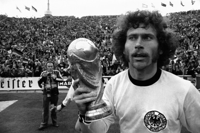west-german-defender-paul-breitner-holds-the-world-cup-aloft-while-running-around-the-olympic-stadium-after-west-germany-beat-holland-2-1-in-the-football-world-cup-final-game-in-munich-germany-on-ju