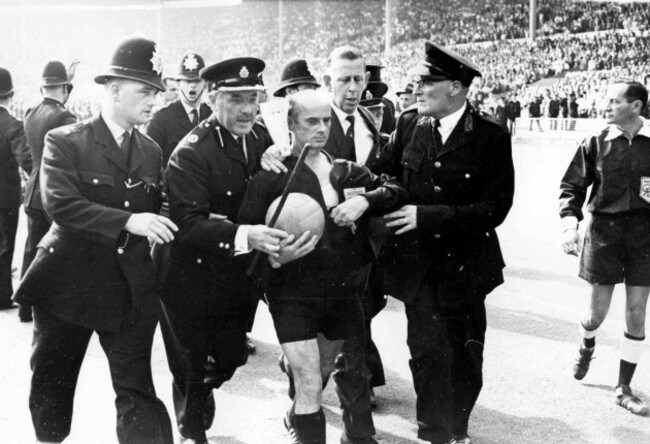 german-referee-rudolf-kreitlin-looks-grim-as-he-is-escorted-from-the-pitch-in-wembley-stadium-london-on-july-23-1966-after-the-match-between-england-and-argentina-during-the-game-kreitlin-sent-of