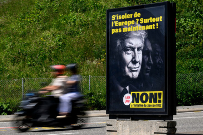 a-poster-reading-isolate-ourselves-from-europe-certainly-not-now-no-to-the-svpudc-chaos-initiative-featuring-images-of-president-donald-trump-russian-president-vladimir-putin-and-chinese-presi