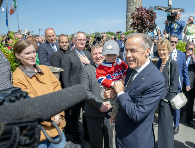 canadian-prime-minister-mark-carney-holds-toddler-malacy-morgan-during-a-visit-to-aughagower-in-co-mayo-as-part-of-his-visit-to-ireland-picture-date-sunday-june-14-2026