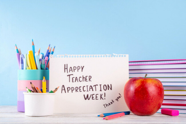 teacher-appreciation-week-background-with-school-supplies-and-traditional-gifts-bouquet-of-spring-flowers-with-pens-pencils-notebooks-notepads-sc
