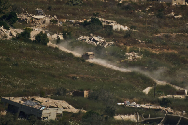 an-israeli-military-vehicle-moves-past-destroyed-buildings-in-southern-lebanon-as-seen-from-northern-israel-friday-june-19-2026-ap-photoleo-correa
