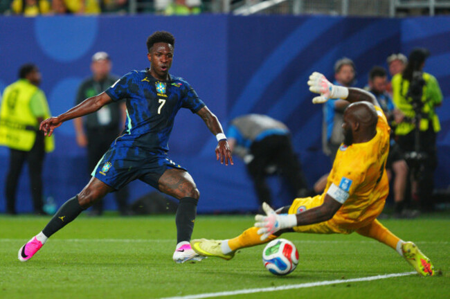 brazils-vinicius-junior-7-scores-the-third-goal-for-his-team-against-haiti-goalkeeper-johny-placide-1-during-the-world-cup-group-c-soccer-match-between-brazil-and-haiti-in-philadelphia-friday-j