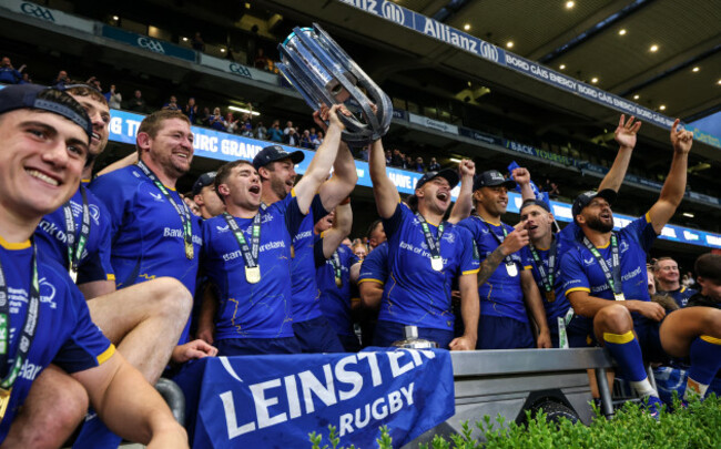 luke-mcgrath-caelan-doris-and-james-lowe-lift-the-urc-trophy-alongside-their-teammates