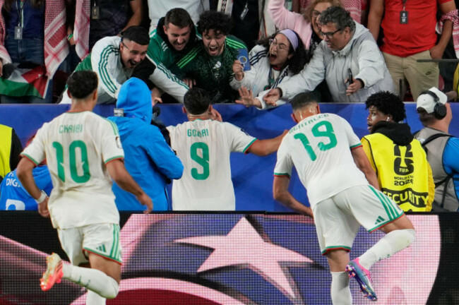 algerias-amine-gouiri-9-celebrates-with-their-supporters-after-scoring-his-sides-second-goal-during-the-world-cup-group-j-soccer-match-between-jordan-and-algeria-in-santa-clara-calif-near-san-f