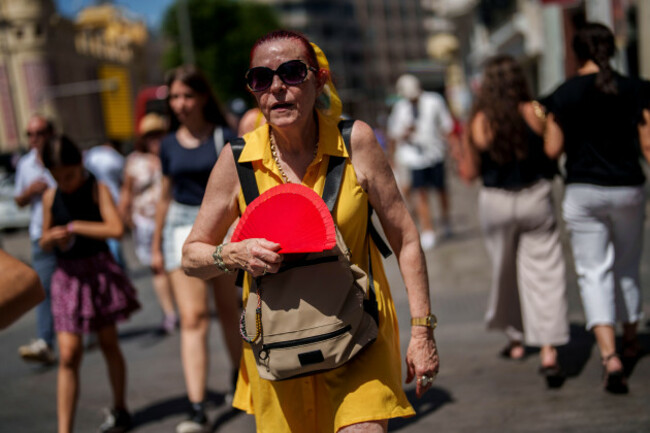 a-woman-fans-herself-in-madrid-spain-monday-july-10-2023-temperatures-are-beginning-to-rise-at-the-start-of-the-second-heatwave-registered-in-spain-this-summer-ap-photomanu-fernandez