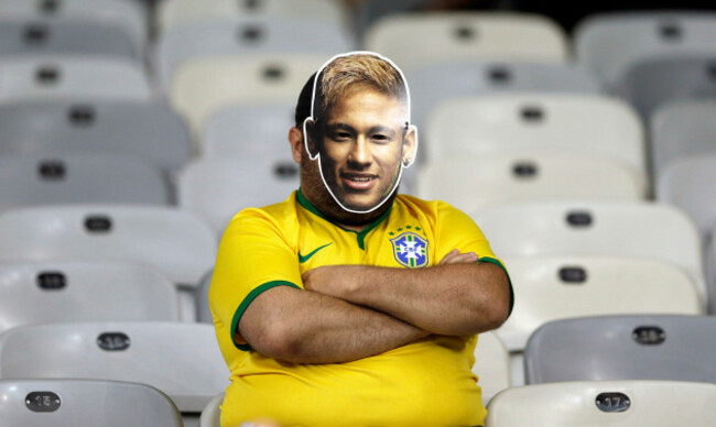 a-brazil-supporter-wearing-a-neymar-face-mask-sits-in-the-stands-after-germany-defeated-brazil-7-1-to-advance-to-the-finals-during-the-world-cup-semifinal-soccer-match-between-brazil-and-germany-at-th