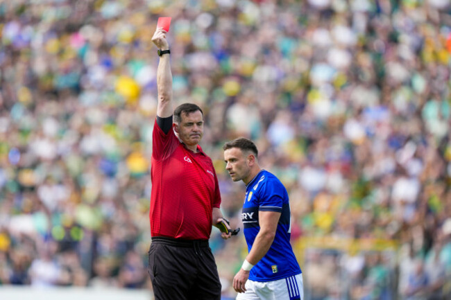 referee-sean-hurson-gives-micheal-burns-a-red-card-at-the-start-of-the-second-half