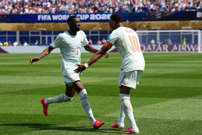 frances-ousmane-dembele-celebrates-with-kylian-mbappe-right-after-scoring-his-sides-third-goal-during-the-world-cup-group-i-soccer-match-between-norway-and-france-in-foxborough-mass-near-boston