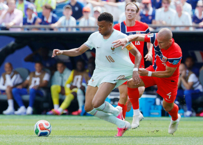 boston-united-states-26th-june-2026-norways-leo-ostigard-4-pulls-the-shirt-of-kylian-mbappe-of-france-as-they-fight-for-the-ball-in-the-first-half-of-a-fifa-world-cup-match-at-boston-stadium-in