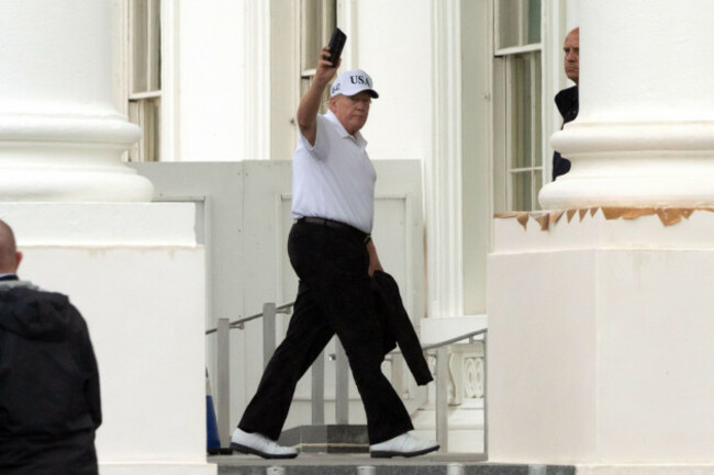 president-donald-trump-waves-as-he-walks-into-the-north-portico-at-the-white-house-sunday-june-28-2026-in-washington-ap-photomark-schiefelbein