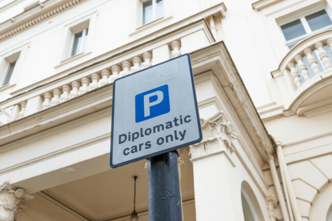 diplomaticcarsonlyparkingsigninfrontofembassybuilding