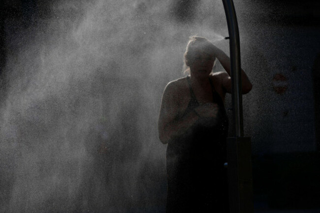 people-are-seen-cooling-off-at-a-spray-mist-fountain-in-warsaw-poland-on-27-june-2026-a-severe-heatwave-gripping-europe-since-june-20-described-as-the-worst-on-record-is-causing-deaths-infrast