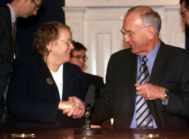 northern-ireland-secretary-mo-mowlam-and-irish-foreign-minister-david-andrews-shake-hands-after-signing-the-four-treaties-to-establish-a-northsouth-ministerial-council-at-dublin-castle