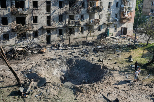 people-look-at-the-site-of-a-russian-missile-strike-that-hit-a-residential-building-in-kyiv-ukraine-thursday-july-2-2026-ap-photoefrem-lukatsky