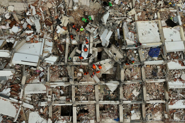 rescue-workers-search-through-the-rubble-of-a-building-destroyed-by-the-earthquakes-in-la-guaira-venezuela-thursday-july-2-2026-ap-photomatias-delacroix