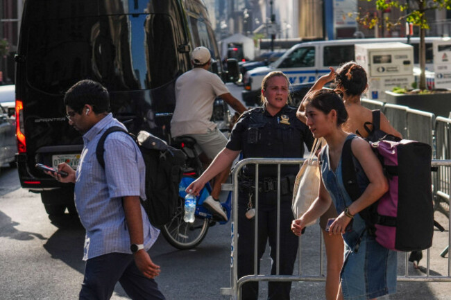 an-nypd-officer-gives-directions-to-a-pedestrian-outside-of-madison-square-garden-ahead-of-a-reported-wedding-between-singer-taylor-swift-and-national-football-league-player-travis-kelce-on-thursday