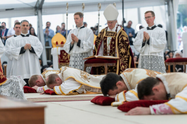 four-bishops-lie-on-the-floor-as-they-are-given-episcopal-consecration-during-a-mass-in-a-tent-set-up-outside-the-society-of-st-pius-x-seminary-in-econe-switzerland-wednesday-july-1-2026-cyril
