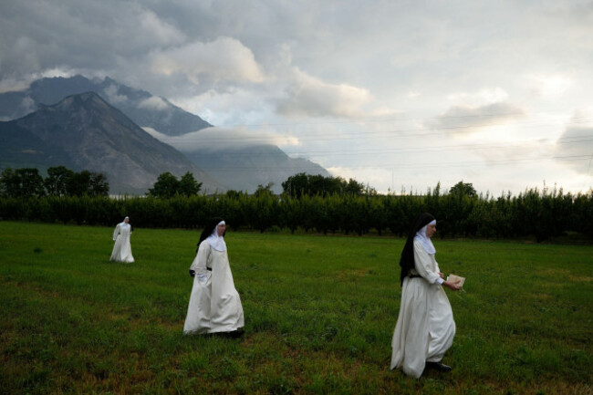nuns-make-their-way-to-a-tent-set-up-outside-the-society-of-st-pius-x-seminary-to-attend-a-consecration-ceremony-for-four-new-bishops-in-econe-switzerland-wednesday-july-1-2026-ap-photobaz-rat